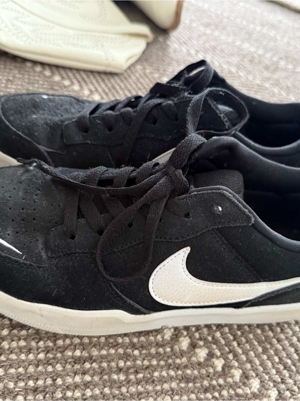 Nike Black Suede Sneakers with White Swoosh Accent